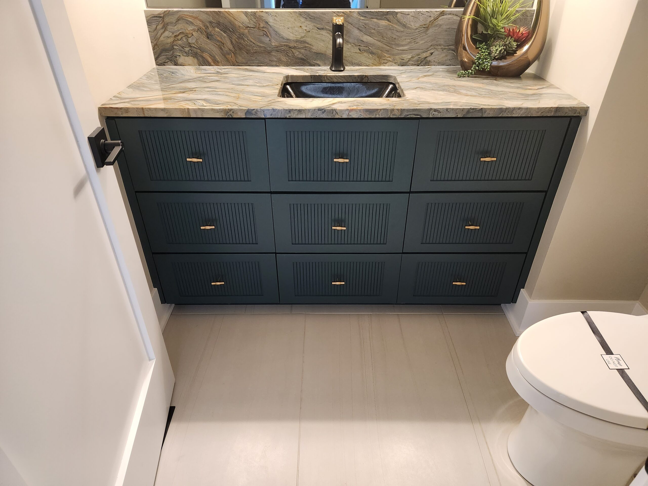 Custom primary bathroom vanity with stone top