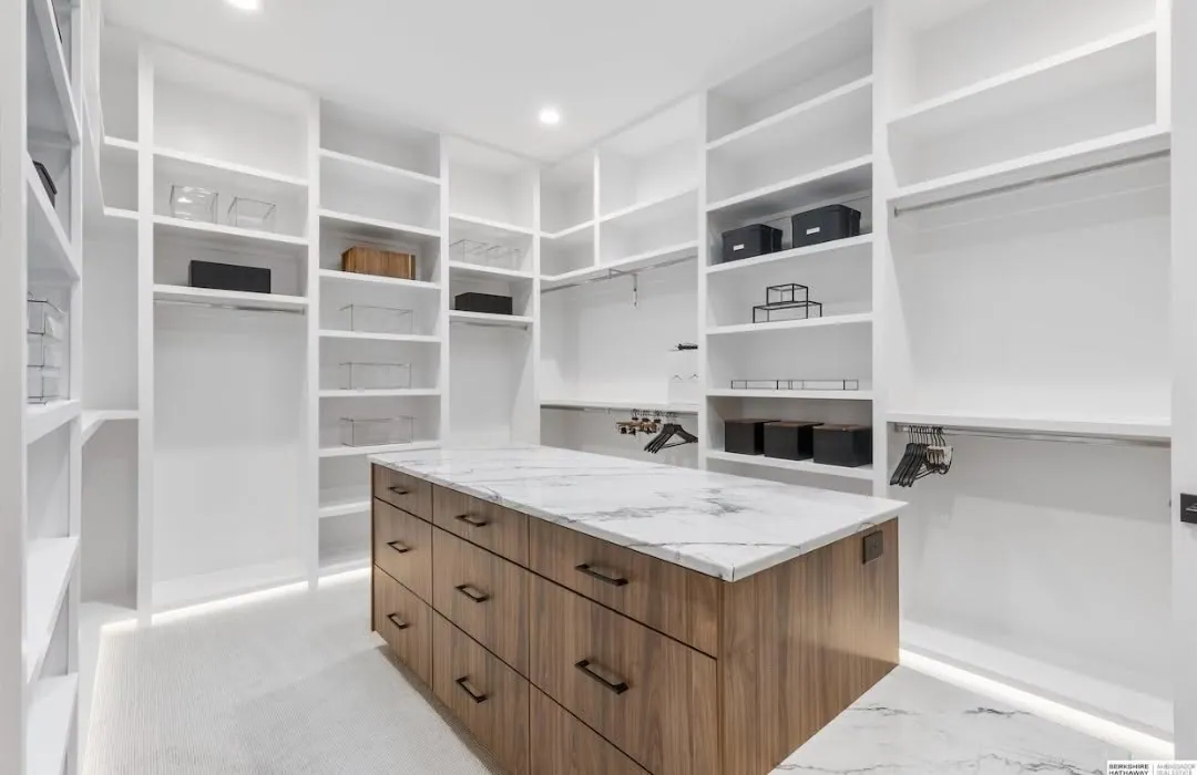 Walk-in closet with a built-in dressing island