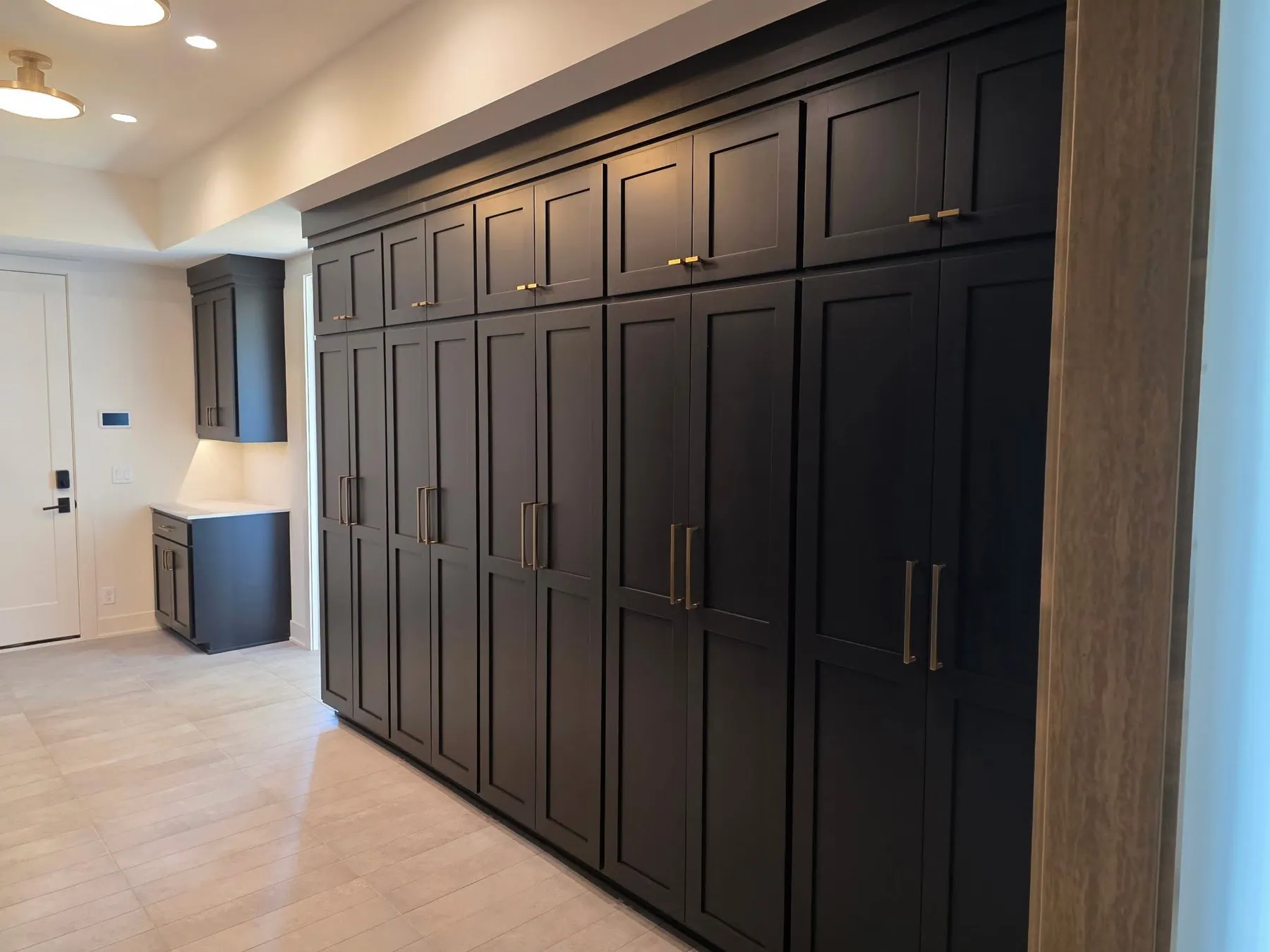 Floor-to-ceiling navy cabinetry