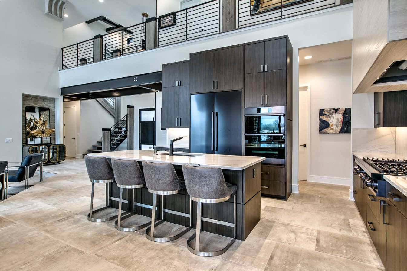 Custom modern kitchen with dark rift cabinetry and a marble island by Fox Custom Cabinets