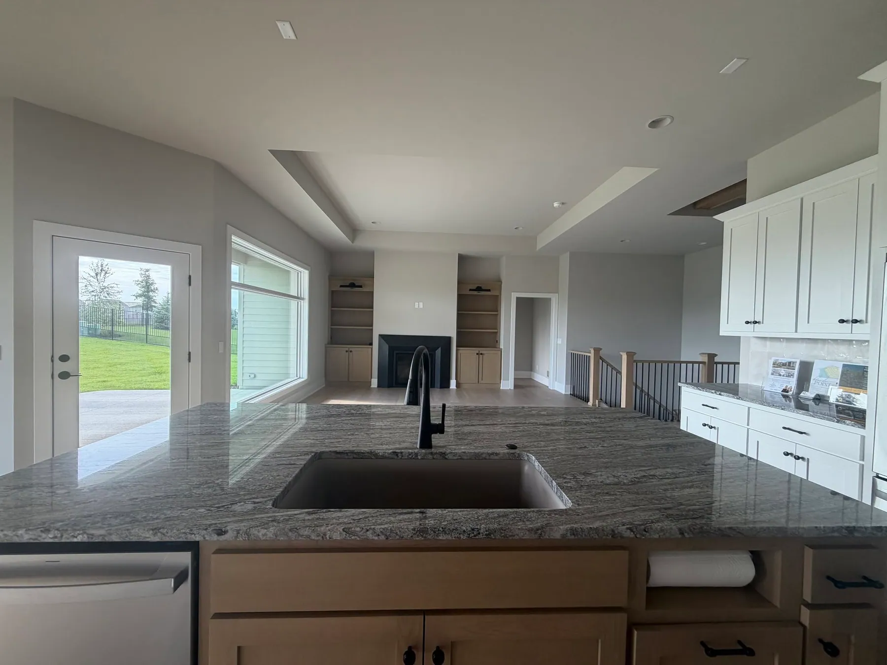Kitchen with a gray island and matte-black fixtures