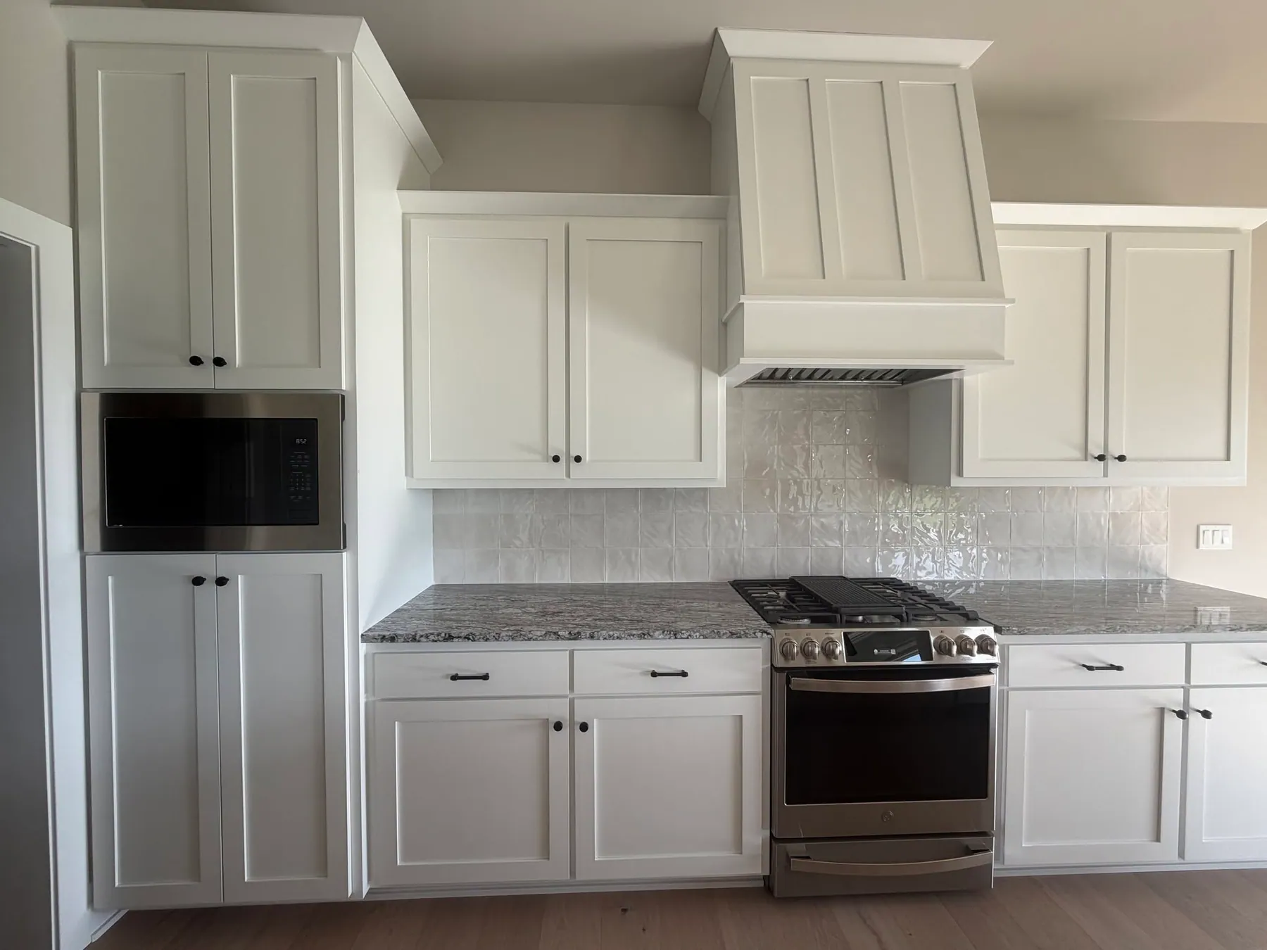 White shaker cabinet doors in a custom Fox Custom Cabinets kitchen