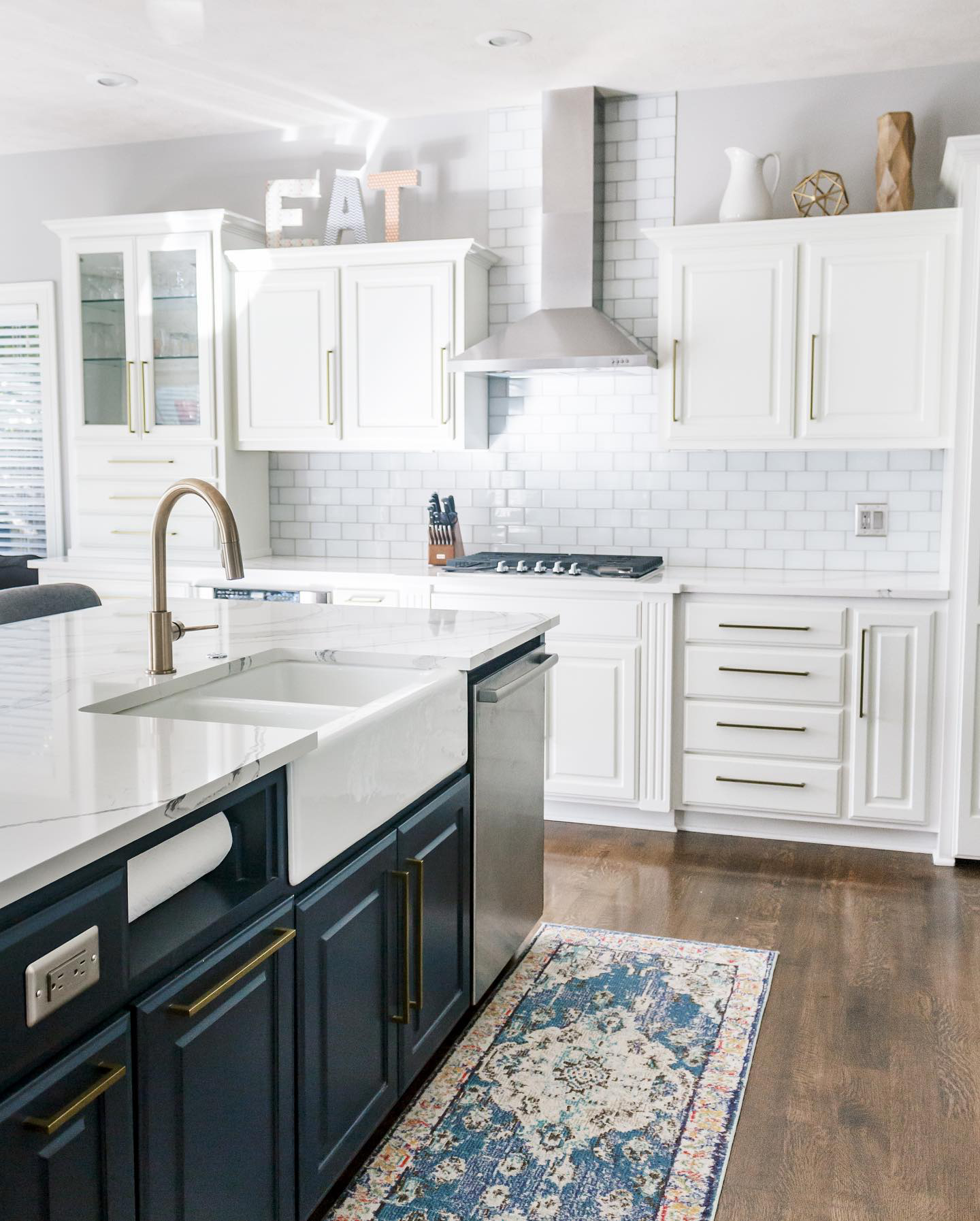 Full-height custom kitchen cabinetry with paneled appliances