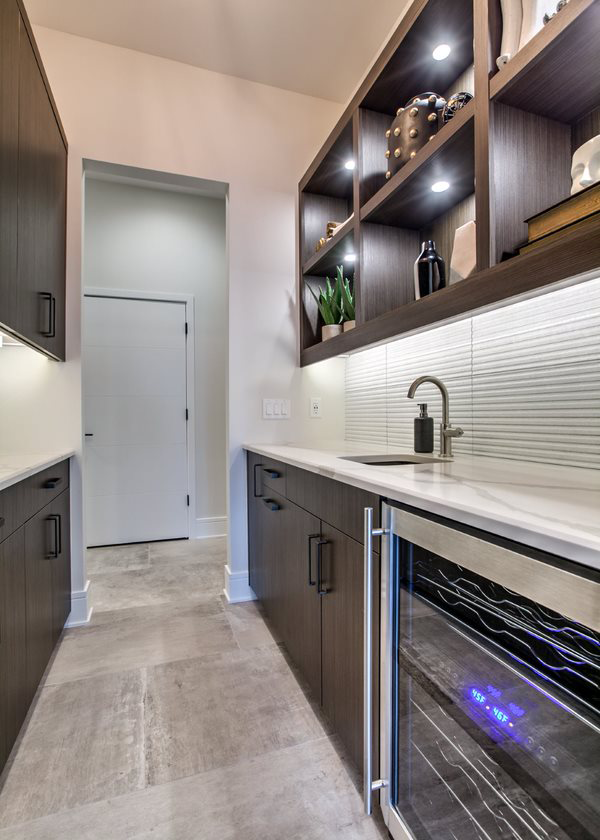 Open-concept kitchen with custom cabinets and stone countertops