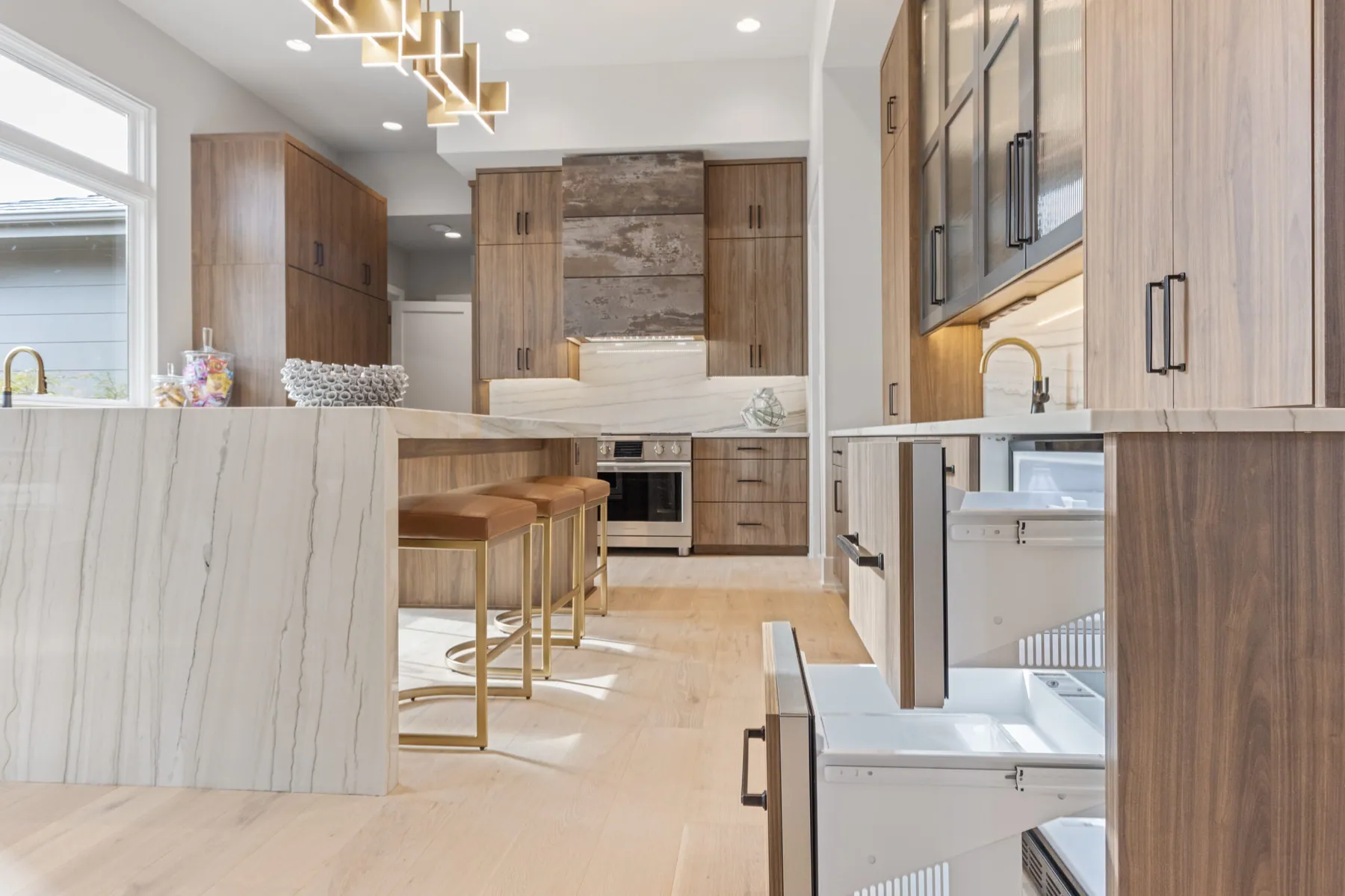 Walnut kitchen with integrated appliances and hidden storage